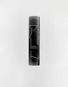 A black bottle of Shu Uemura Moya Hold Finishing Hair Spray with water droplets on a white background.