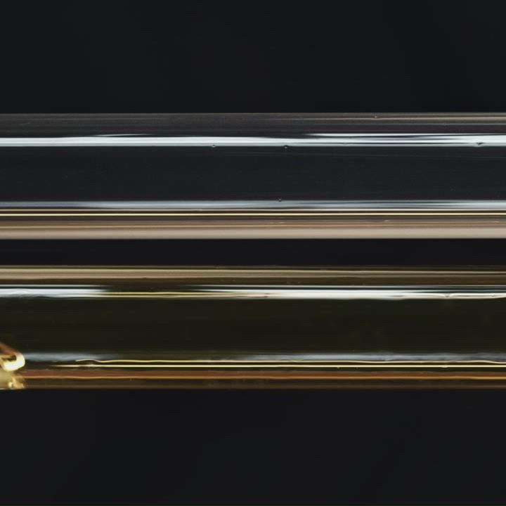 Four black bottles of Shu Uemura Ashita Supreme intense revitalization haircare products, including shampoo, conditioner, mask, and spray, displayed on a black and red gradient background.