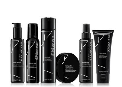 Six black bottles and containers of Shu Uemura hair styling products, including Netsu Design Blow Dry Cream, Awa Volume Mousse, Moya Hold Finishing Spray, Ishi Sculpt Sculpting Paste, Shiki Worker Blow Dry Serum, and Umou Hold Cream.