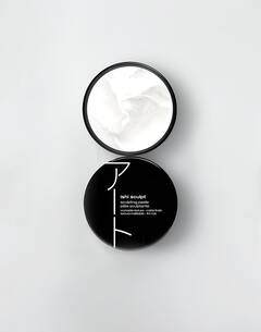 An open jar of Shu Uemura Ishi Sculpt sculpting paste with white product inside, displayed on a white background.