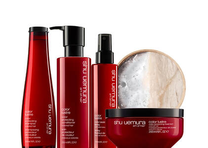 Shu Uemura Color Lustre hair care products including shampoo, conditioner, spray, and treatment mask, displayed with a marble-textured background.